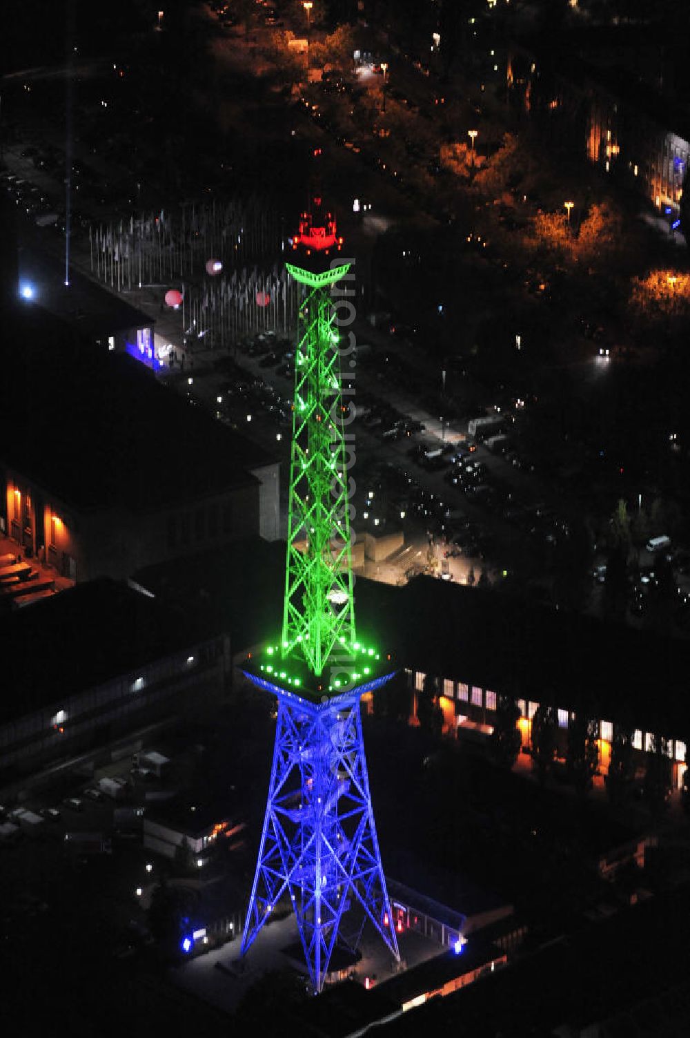 Berlin at night from above - Nachtaufnahme: Sicht auf das beleuchtete Messegelände mit dem Funkturm anlässlich des Festival Of Lights 2010 in Berlin. Nightshot: View to the illuminated exhibition ground with the Radio Tower Berlin in celebration of the Festival Of Lights 2010.