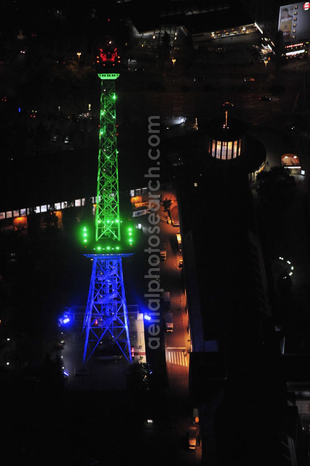 Aerial photograph at night Berlin - Nachtaufnahme: Sicht auf das beleuchtete Messegelände mit dem Funkturm anlässlich des Festival Of Lights 2010 in Berlin. Nightshot: View to the illuminated exhibition ground with the Radio Tower Berlin in celebration of the Festival Of Lights 2010.