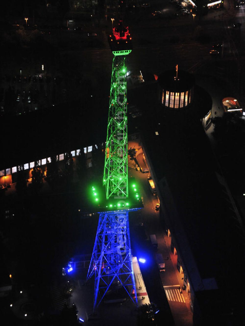 Berlin at night from above - Nachtaufnahme: Sicht auf das beleuchtete Messegelände mit dem Funkturm anlässlich des Festival Of Lights 2010 in Berlin. Nightshot: View to the illuminated exhibition ground with the Radio Tower Berlin in celebration of the Festival Of Lights 2010.