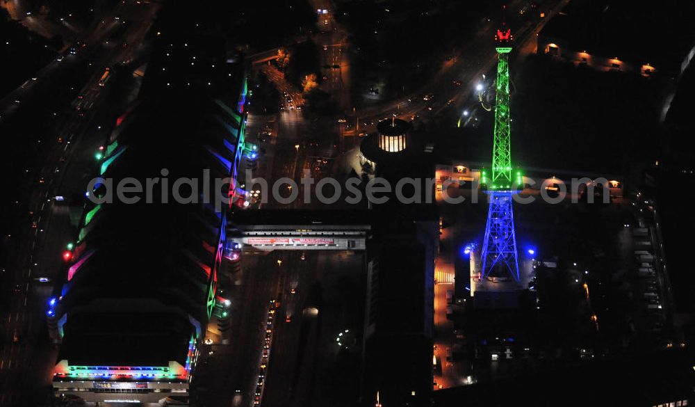 Berlin at night from the bird perspective: Nachtaufnahme: Sicht auf das beleuchtete Messegelände mit dem ICC Konfesscenter am Funkturm anlässlich des Festival Of Lights 2010 in Berlin. Nightshot: View to the illuminated exhibition ground with the Radio Tower Berlin in celebration of the Festival Of Lights 2010.