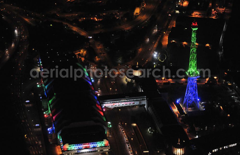 Berlin at night from the bird perspective: Nachtaufnahme: Sicht auf das beleuchtete Messegelände mit dem ICC Konfesscenter am Funkturm anlässlich des Festival Of Lights 2010 in Berlin. Nightshot: View to the illuminated exhibition ground with the Radio Tower Berlin in celebration of the Festival Of Lights 2010.