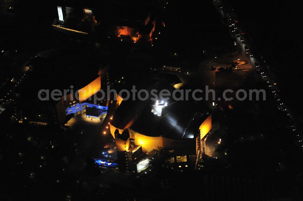 Berlin at night from the bird perspective: Nachtaufnahme: Sicht auf die beleuchtete Philharmonie am Potsdamer Platz anlässlich des Festival Of Lights 2010 in Berlin. Nightshot: View to the illuminated philharmonic hall in the city centre of Berlin in celebration of the Festival Of Lights 2010.