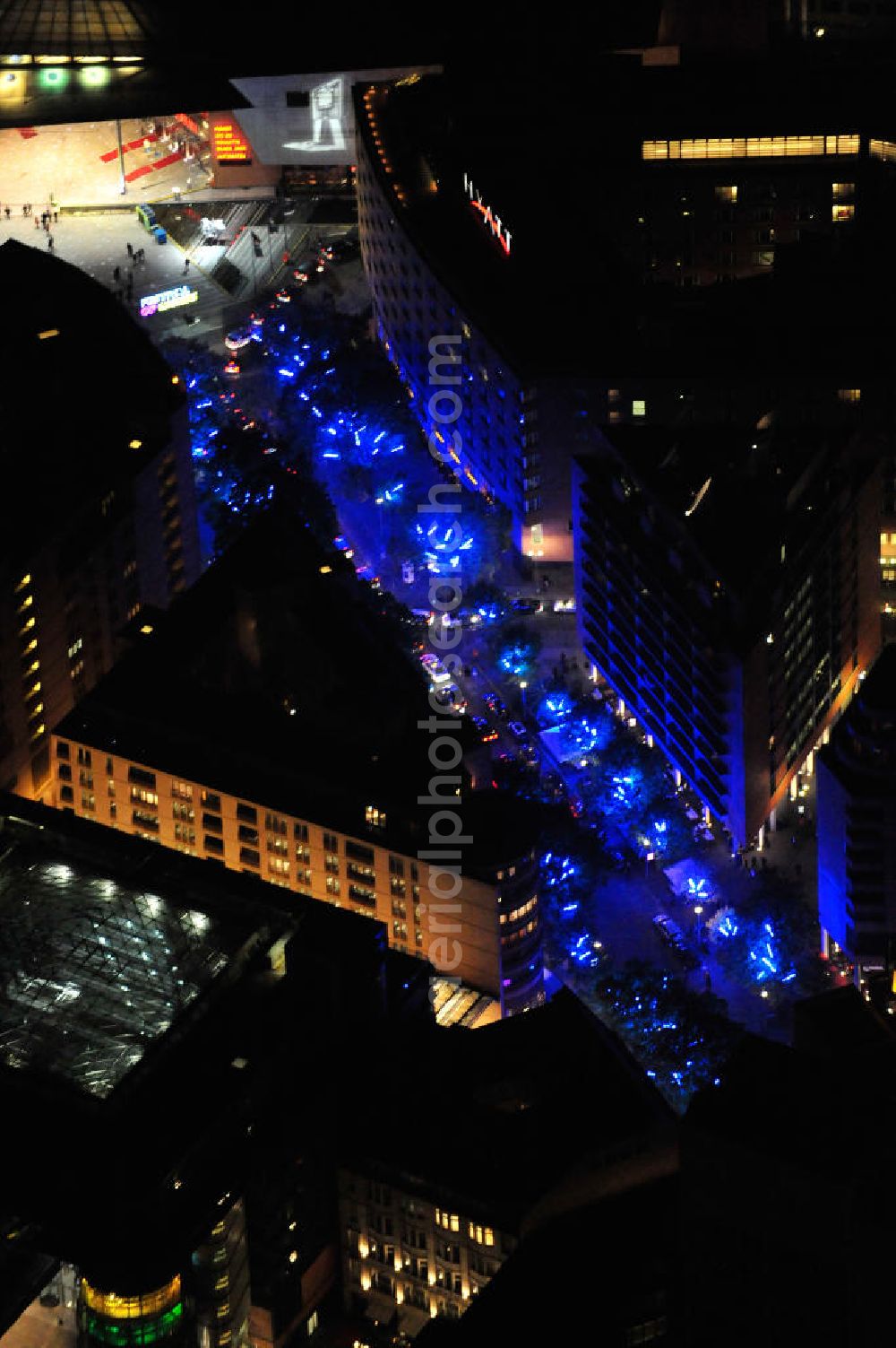 Berlin at night from the bird perspective: Nachtluftbild vom nächtlichen Berlin anläßlich des Festival of Lights in der Berliner Innenstadt. Hunderttausende Besucher strömten am letzten Wochenende des Festivals zu den illuminierten Gebäuden und angestrahlten Bereichen der Innenstadt. Blick auf das Gebiet Potsdamer Platz, hier die Alte Potsdamer Straße hin zum Marlene-Dietrich-Platz, daneben das Hotel Grand Hyatt Berlin der Hyatt Hotels Corporation. Night shot of Berlin's illuminated inner-city; here the view over the street Alte Potsdamer Strasse up to the square Marlene-Dietrich-Platz with the Hotel Grand Hyatt Berlin on the right side.