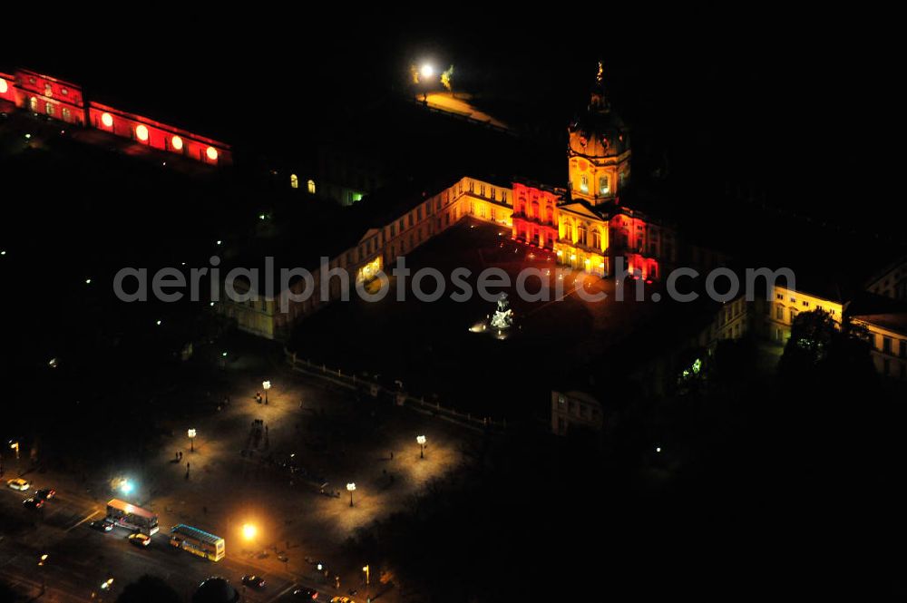 Berlin at night from the bird perspective: Nachtluftbild vom Schloß Charlottenburg am Spandauer Damm anläßlich des Festival of Lights in der Berliner Innenstadt. Hunderttausende Besucher strömten am letzten Wochenende des Festivals zu den illuminierten Gebäuden und angestrahlten Bereichen der Innenstadt. Night shot of the castle Charlottenburg during the festival of light in Berlins inner-city.