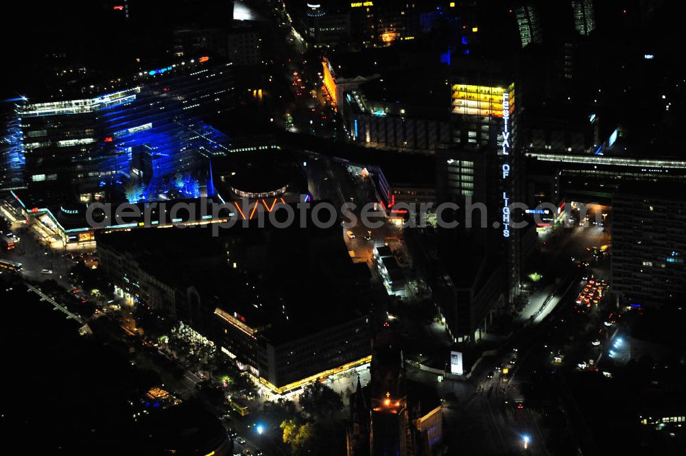 Aerial photograph at night Berlin - Nachtluftbild vom nächtlichen Berlin anläßlich des Festival of Lights in der Berliner Innenstadt, hier der Bereich zwischen Kantstraße, Joachimsthaler Straße, Hardenbergstraße. Hunderttausende Besucher strömten am letzten Wochenende des Festivals zu den illuminierten Gebäuden und angestrahlten Bereichen der Innenstadt. Im Zoofenster wird hauptsächlich das Luxushotel The Waldorf Astoria Collection des Hilton-Konzerns in einem Neubau der Firma SWAN Operation Ltd untergebracht werden. Night shot of berlins illuminated inner-city at the streets Kantstrasse, Hardenbergstraße and Joachimsthaler Straße. In the tower Zoofenster will reside the luxury hotel The Waldorf Astoria which is part of the Hilton concern.