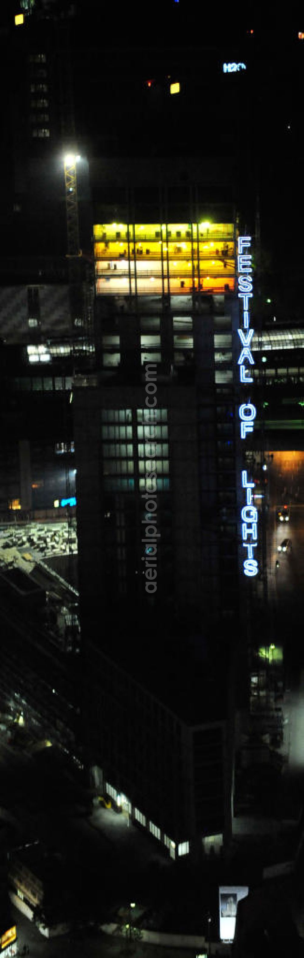 Aerial image at night Berlin - Nachtluftbild vom nächtlichen Berlin anläßlich des Festival of Lights in der Berliner Innenstadt, hier der Bereich zwischen Kantstraße, Joachimsthaler Straße, Hardenbergstraße. Hunderttausende Besucher strömten am letzten Wochenende des Festivals zu den illuminierten Gebäuden und angestrahlten Bereichen der Innenstadt. Im Zoofenster wird hauptsächlich das Luxushotel The Waldorf Astoria Collection des Hilton-Konzerns in einem Neubau der Firma SWAN Operation Ltd untergebracht werden. Night shot of berlins illuminated inner-city at the streets Kantstrasse, Hardenbergstraße and Joachimsthaler Straße. In the tower Zoofenster will reside the luxury hotel The Waldorf Astoria which is part of the Hilton concern.