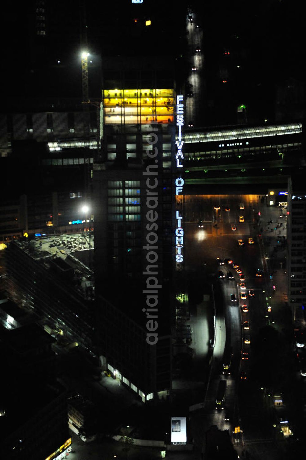 Berlin at night from above - Nachtluftbild vom nächtlichen Berlin anläßlich des Festival of Lights in der Berliner Innenstadt, hier der Bereich zwischen Kantstraße, Joachimsthaler Straße, Hardenbergstraße. Hunderttausende Besucher strömten am letzten Wochenende des Festivals zu den illuminierten Gebäuden und angestrahlten Bereichen der Innenstadt. Im Zoofenster wird hauptsächlich das Luxushotel The Waldorf Astoria Collection des Hilton-Konzerns in einem Neubau der Firma SWAN Operation Ltd untergebracht werden. Night shot of berlins illuminated inner-city at the streets Kantstrasse, Hardenbergstraße and Joachimsthaler Straße. In the tower Zoofenster will reside the luxury hotel The Waldorf Astoria which is part of the Hilton concern.