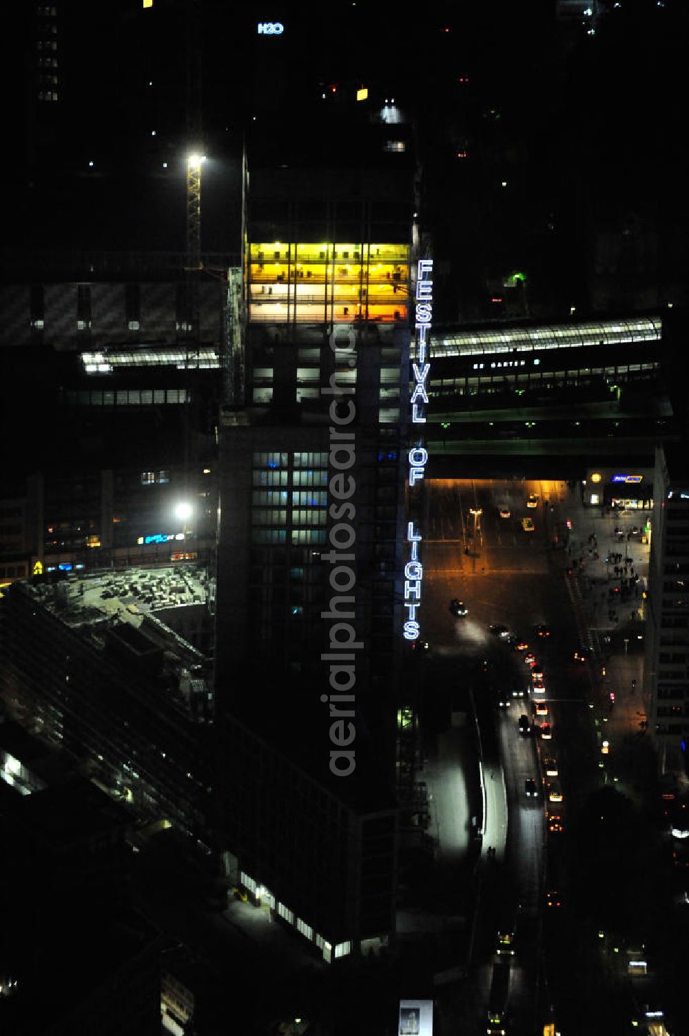 Berlin at night from the bird perspective: Nachtluftbild vom nächtlichen Berlin anläßlich des Festival of Lights in der Berliner Innenstadt, hier der Bereich zwischen Kantstraße, Joachimsthaler Straße, Hardenbergstraße. Hunderttausende Besucher strömten am letzten Wochenende des Festivals zu den illuminierten Gebäuden und angestrahlten Bereichen der Innenstadt. Im Zoofenster wird hauptsächlich das Luxushotel The Waldorf Astoria Collection des Hilton-Konzerns in einem Neubau der Firma SWAN Operation Ltd untergebracht werden. Night shot of berlins illuminated inner-city at the streets Kantstrasse, Hardenbergstraße and Joachimsthaler Straße. In the tower Zoofenster will reside the luxury hotel The Waldorf Astoria which is part of the Hilton concern.