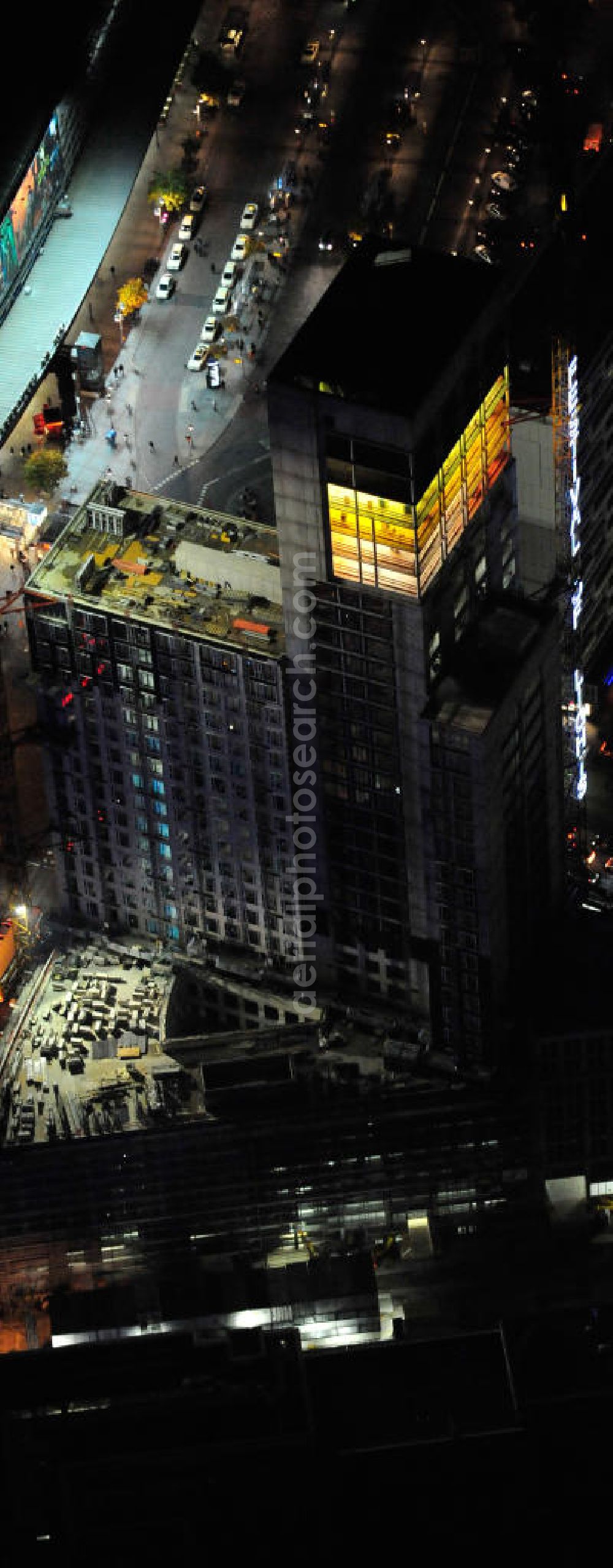 Aerial photograph at night Berlin - Nachtluftbild vom nächtlichen Berlin anläßlich des Festival of Lights in der Berliner Innenstadt, hier der Bereich zwischen Kantstraße, Joachimsthaler Straße, Hardenbergstraße. Hunderttausende Besucher strömten am letzten Wochenende des Festivals zu den illuminierten Gebäuden und angestrahlten Bereichen der Innenstadt. Im Zoofenster wird hauptsächlich das Luxushotel The Waldorf Astoria Collection des Hilton-Konzerns in einem Neubau der Firma SWAN Operation Ltd untergebracht werden. Night shot of berlins illuminated inner-city at the streets Kantstrasse, Hardenbergstraße and Joachimsthaler Straße. In the tower Zoofenster will reside the luxury hotel The Waldorf Astoria which is part of the Hilton concern.