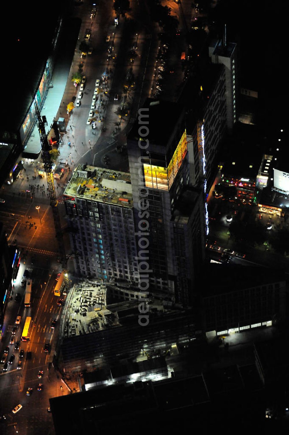 Aerial image at night Berlin - Nachtluftbild vom nächtlichen Berlin anläßlich des Festival of Lights in der Berliner Innenstadt, hier der Bereich zwischen Kantstraße, Joachimsthaler Straße, Hardenbergstraße. Hunderttausende Besucher strömten am letzten Wochenende des Festivals zu den illuminierten Gebäuden und angestrahlten Bereichen der Innenstadt. Im Zoofenster wird hauptsächlich das Luxushotel The Waldorf Astoria Collection des Hilton-Konzerns in einem Neubau der Firma SWAN Operation Ltd untergebracht werden. Night shot of berlins illuminated inner-city at the streets Kantstrasse, Hardenbergstraße and Joachimsthaler Straße. In the tower Zoofenster will reside the luxury hotel The Waldorf Astoria which is part of the Hilton concern.