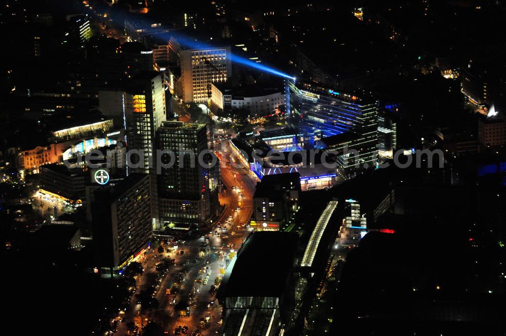 Berlin at night from above - Nachtluftbild vom nächtlichen Berlin anläßlich des Festival of Lights in der Berliner Innenstadt, hier der Bereich zwischen Kantstraße, Joachimsthaler Straße, Hardenbergstraße. Hunderttausende Besucher strömten am letzten Wochenende des Festivals zu den illuminierten Gebäuden und angestrahlten Bereichen der Innenstadt. Im Zoofenster wird hauptsächlich das Luxushotel The Waldorf Astoria Collection des Hilton-Konzerns in einem Neubau der Firma SWAN Operation Ltd untergebracht werden. Night shot of berlins illuminated inner-city at the streets Kantstrasse, Hardenbergstraße and Joachimsthaler Straße. In the tower Zoofenster will reside the luxury hotel The Waldorf Astoria which is part of the Hilton concern.