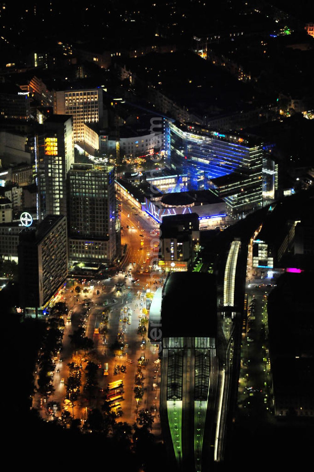 Berlin at night from the bird perspective: Nachtluftbild vom nächtlichen Berlin anläßlich des Festival of Lights in der Berliner Innenstadt, hier der Bereich zwischen Kantstraße, Joachimsthaler Straße, Hardenbergstraße. Hunderttausende Besucher strömten am letzten Wochenende des Festivals zu den illuminierten Gebäuden und angestrahlten Bereichen der Innenstadt. Im Zoofenster wird hauptsächlich das Luxushotel The Waldorf Astoria Collection des Hilton-Konzerns in einem Neubau der Firma SWAN Operation Ltd untergebracht werden. Night shot of berlins illuminated inner-city at the streets Kantstrasse, Hardenbergstraße and Joachimsthaler Straße. In the tower Zoofenster will reside the luxury hotel The Waldorf Astoria which is part of the Hilton concern.