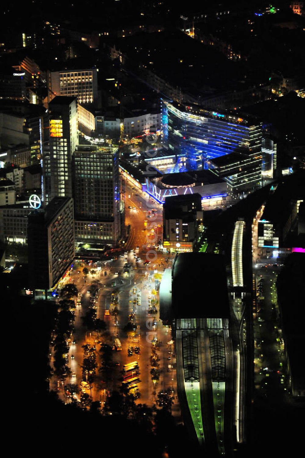 Aerial photograph at night Berlin - Nachtluftbild vom nächtlichen Berlin anläßlich des Festival of Lights in der Berliner Innenstadt, hier der Bereich zwischen Kantstraße, Joachimsthaler Straße, Hardenbergstraße. Hunderttausende Besucher strömten am letzten Wochenende des Festivals zu den illuminierten Gebäuden und angestrahlten Bereichen der Innenstadt. Im Zoofenster wird hauptsächlich das Luxushotel The Waldorf Astoria Collection des Hilton-Konzerns in einem Neubau der Firma SWAN Operation Ltd untergebracht werden. Night shot of berlins illuminated inner-city at the streets Kantstrasse, Hardenbergstraße and Joachimsthaler Straße. In the tower Zoofenster will reside the luxury hotel The Waldorf Astoria which is part of the Hilton concern.