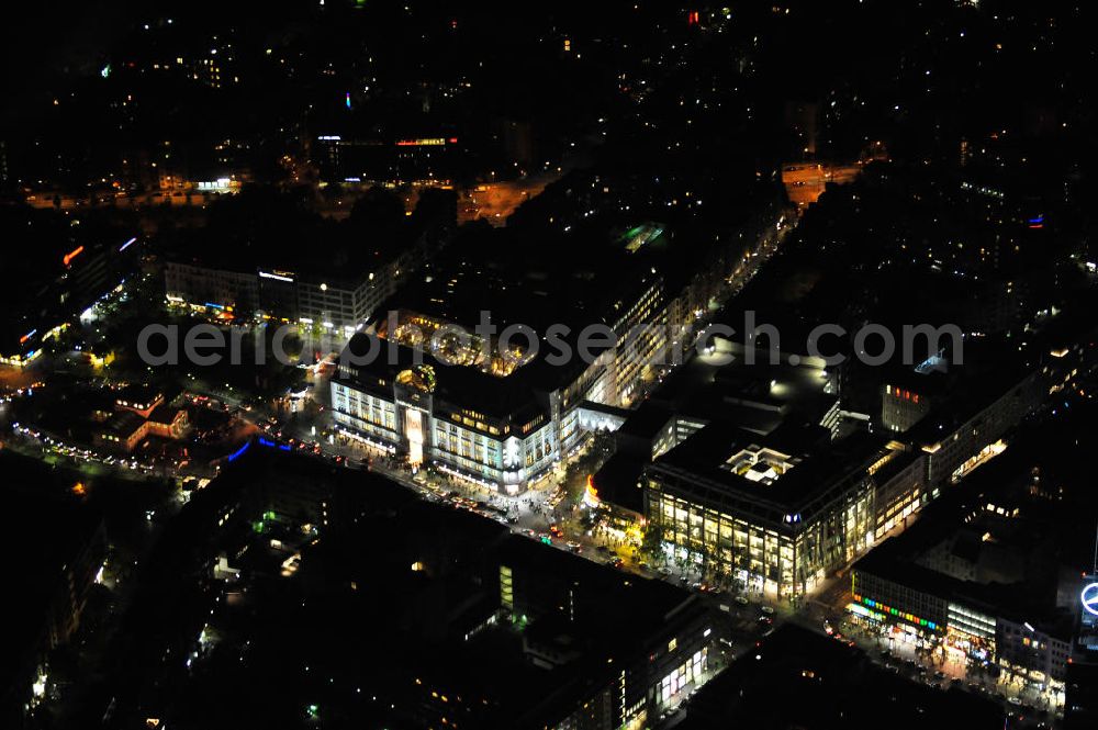 Berlin at night from above - Nachtluftbild: Blick auf das KaDeWe , das Kaufhaus des Westens am Wittenbergplatz in Berlin - Schöneberg. Das KaDeWe ist ein deutsches Luxuswarenhaus, das von Adolf Jandorf gegründet und am 27. März 1907 eröffnet wurde. Es ist heute mit 60.000 m² Verkaufsfläche das zweitgrößte Warenhaus Kontinentaleuropas. Es befindet sich in der Tauentzienstraße in Berlin-Schöneberg am Wittenbergplatz und ist das bekannteste Warenhaus Deutschlands. Das KaDeWe gehört der Nicolas Berggruen Holdings GmbH. Night shot: view on the KaDeWe, the Department Store of the West at Wittenbergplatz in Berlin's district Schoeneberg. It is a german luxury department store founded by Adolf Jandorf, opened march 27th, 1907. Today it's europe's second largest department store with a selling space of 60.000 m², located in the street Tauentzienstrasse near the square Wittenbergplatz. It's Germany's the best known department store. The KaDeWe is belonging to Nicolas Berggruen Holdings GmbH.