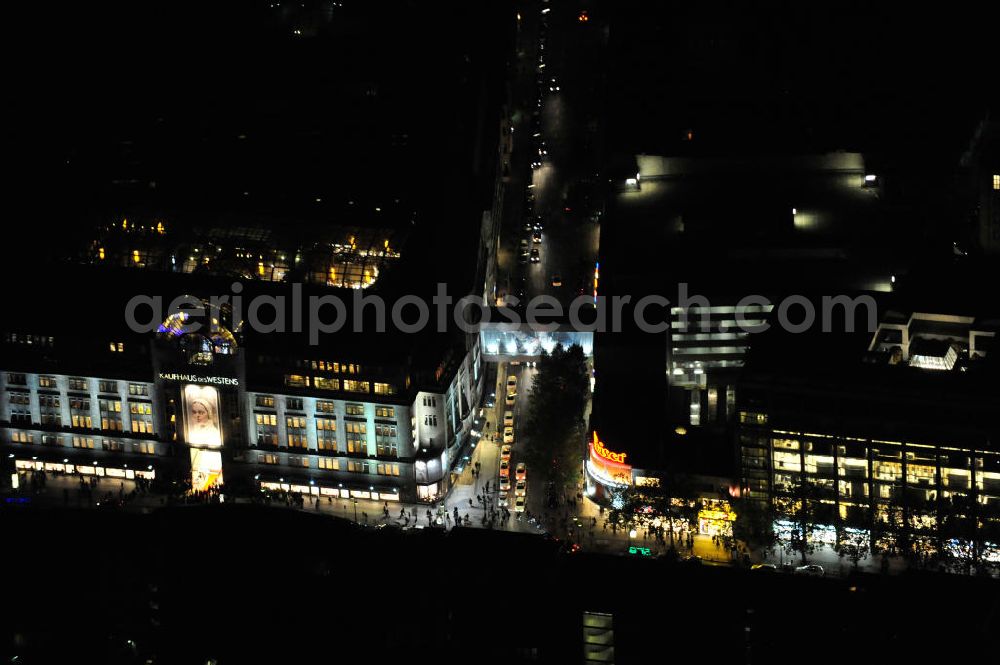 Aerial photograph at night Berlin - Nachtluftbild: Blick auf das KaDeWe , das Kaufhaus des Westens am Wittenbergplatz in Berlin - Schöneberg. Das KaDeWe ist ein deutsches Luxuswarenhaus, das von Adolf Jandorf gegründet und am 27. März 1907 eröffnet wurde. Es ist heute mit 60.000 m² Verkaufsfläche das zweitgrößte Warenhaus Kontinentaleuropas. Es befindet sich in der Tauentzienstraße in Berlin-Schöneberg am Wittenbergplatz und ist das bekannteste Warenhaus Deutschlands. Das KaDeWe gehört der Nicolas Berggruen Holdings GmbH. Night shot: view on the KaDeWe, the Department Store of the West at Wittenbergplatz in Berlin's district Schoeneberg. It is a german luxury department store founded by Adolf Jandorf, opened march 27th, 1907. Today it's europe's second largest department store with a selling space of 60.000 m², located in the street Tauentzienstrasse near the square Wittenbergplatz. It's Germany's the best known department store. The KaDeWe is belonging to Nicolas Berggruen Holdings GmbH.