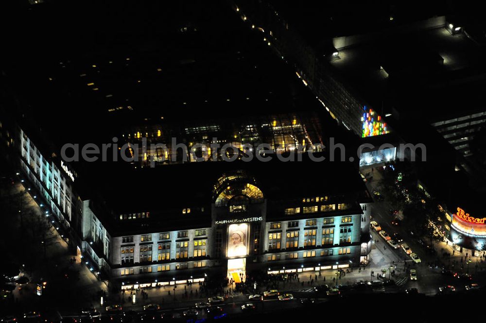 Berlin at night from above - Nachtluftbild: Blick auf das KaDeWe , das Kaufhaus des Westens am Wittenbergplatz in Berlin - Schöneberg. Das KaDeWe ist ein deutsches Luxuswarenhaus, das von Adolf Jandorf gegründet und am 27. März 1907 eröffnet wurde. Es ist heute mit 60.000 m² Verkaufsfläche das zweitgrößte Warenhaus Kontinentaleuropas. Es befindet sich in der Tauentzienstraße in Berlin-Schöneberg am Wittenbergplatz und ist das bekannteste Warenhaus Deutschlands. Das KaDeWe gehört der Nicolas Berggruen Holdings GmbH. Night shot: view on the KaDeWe, the Department Store of the West at Wittenbergplatz in Berlin's district Schoeneberg. It is a german luxury department store founded by Adolf Jandorf, opened march 27th, 1907. Today it's europe's second largest department store with a selling space of 60.000 m², located in the street Tauentzienstrasse near the square Wittenbergplatz. It's Germany's the best known department store. The KaDeWe is belonging to Nicolas Berggruen Holdings GmbH.