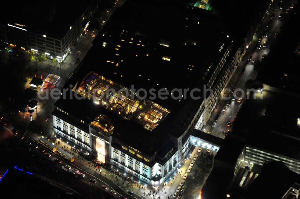 Aerial photograph at night Berlin - Nachtluftbild: Blick auf das KaDeWe , das Kaufhaus des Westens am Wittenbergplatz in Berlin - Schöneberg. Das KaDeWe ist ein deutsches Luxuswarenhaus, das von Adolf Jandorf gegründet und am 27. März 1907 eröffnet wurde. Es ist heute mit 60.000 m² Verkaufsfläche das zweitgrößte Warenhaus Kontinentaleuropas. Es befindet sich in der Tauentzienstraße in Berlin-Schöneberg am Wittenbergplatz und ist das bekannteste Warenhaus Deutschlands. Das KaDeWe gehört der Nicolas Berggruen Holdings GmbH. Night shot: view on the KaDeWe, the Department Store of the West at Wittenbergplatz in Berlin's district Schoeneberg. It is a german luxury department store founded by Adolf Jandorf, opened march 27th, 1907. Today it's europe's second largest department store with a selling space of 60.000 m², located in the street Tauentzienstrasse near the square Wittenbergplatz. It's Germany's the best known department store. The KaDeWe is belonging to Nicolas Berggruen Holdings GmbH.