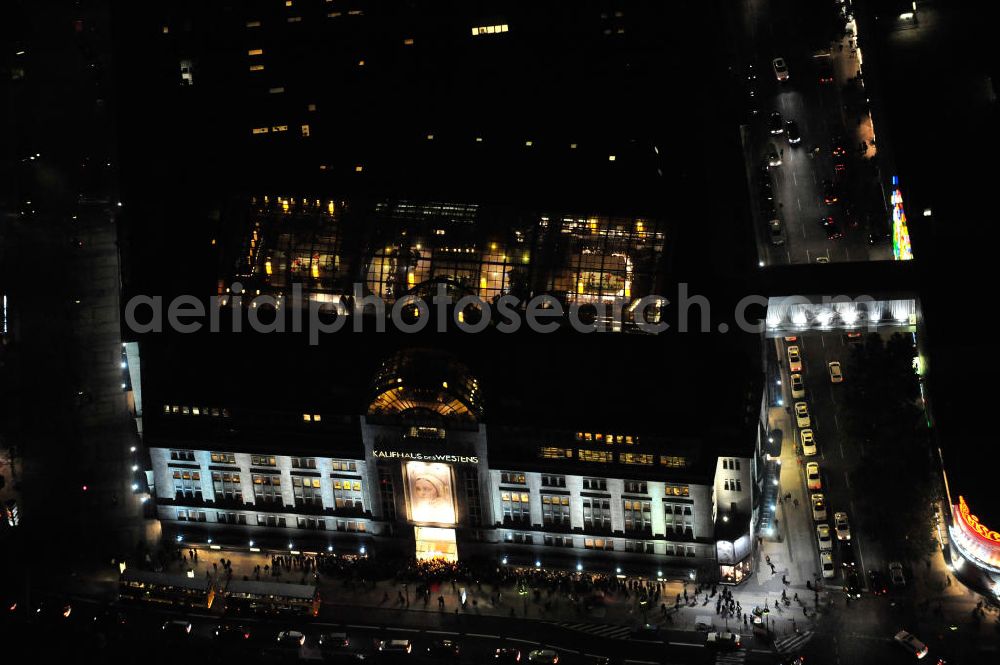 Aerial image at night Berlin - Nachtluftbild: Blick auf das KaDeWe , das Kaufhaus des Westens am Wittenbergplatz in Berlin - Schöneberg. Das KaDeWe ist ein deutsches Luxuswarenhaus, das von Adolf Jandorf gegründet und am 27. März 1907 eröffnet wurde. Es ist heute mit 60.000 m² Verkaufsfläche das zweitgrößte Warenhaus Kontinentaleuropas. Es befindet sich in der Tauentzienstraße in Berlin-Schöneberg am Wittenbergplatz und ist das bekannteste Warenhaus Deutschlands. Das KaDeWe gehört der Nicolas Berggruen Holdings GmbH. Night shot: view on the KaDeWe, the Department Store of the West at Wittenbergplatz in Berlin's district Schoeneberg. It is a german luxury department store founded by Adolf Jandorf, opened march 27th, 1907. Today it's europe's second largest department store with a selling space of 60.000 m², located in the street Tauentzienstrasse near the square Wittenbergplatz. It's Germany's the best known department store. The KaDeWe is belonging to Nicolas Berggruen Holdings GmbH.