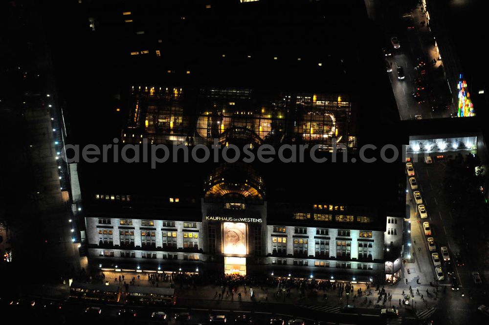 Berlin at night from above - Nachtluftbild: Blick auf das KaDeWe , das Kaufhaus des Westens am Wittenbergplatz in Berlin - Schöneberg. Das KaDeWe ist ein deutsches Luxuswarenhaus, das von Adolf Jandorf gegründet und am 27. März 1907 eröffnet wurde. Es ist heute mit 60.000 m² Verkaufsfläche das zweitgrößte Warenhaus Kontinentaleuropas. Es befindet sich in der Tauentzienstraße in Berlin-Schöneberg am Wittenbergplatz und ist das bekannteste Warenhaus Deutschlands. Das KaDeWe gehört der Nicolas Berggruen Holdings GmbH. Night shot: view on the KaDeWe, the Department Store of the West at Wittenbergplatz in Berlin's district Schoeneberg. It is a german luxury department store founded by Adolf Jandorf, opened march 27th, 1907. Today it's europe's second largest department store with a selling space of 60.000 m², located in the street Tauentzienstrasse near the square Wittenbergplatz. It's Germany's the best known department store. The KaDeWe is belonging to Nicolas Berggruen Holdings GmbH.