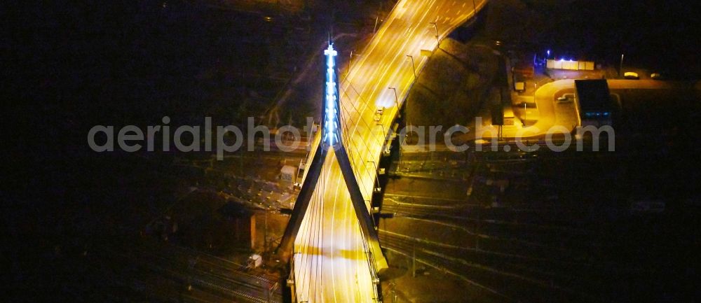 Aerial image at night Halle (Saale) - Night lighting View of Berlin Bridge in Halle (Saale) in Saxony-Anhalt