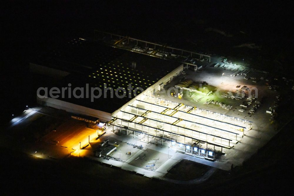 Aerial image at night Niedere Börde - Night lighting Mixed concrete and building materials factory of Rekers Betonwerk GmbH & Co. KG on Langer Schlag in Niedere Boerde in the state Saxony-Anhalt, Germany