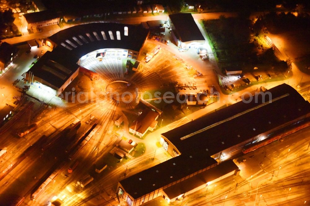 Aerial photograph at night Rostock - Night lighting Trackage and rail routes on the roundhouse - locomotive hall of the railway operations work of Deutsche Bahn in Rostock in the state Mecklenburg - Western Pomerania, Germany