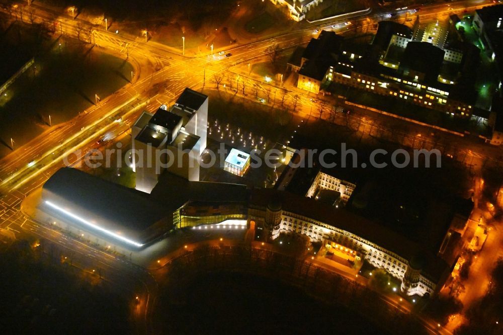 Aerial image at night Leipzig - Night lighting Library Building of Deutsche Nationalbibliothek Deutsches Buch- and Schriftmuseum Deutsche Nationalbibliothek on ensemble Deutscher Platz in the district Zentrum-Suedost in Leipzig in the state Saxony