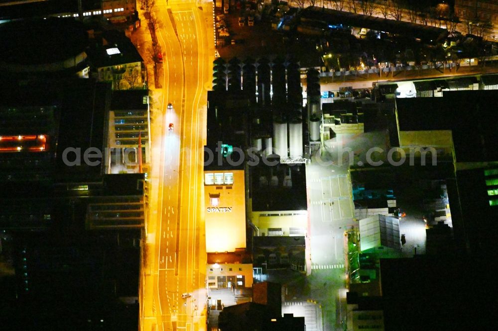 München at night from above - Night lighting buildings and production halls on the premises of the Spaten-Brauerei brewery on Marsstrasse in the district of Maxvorstadt in Munich in the state Bavaria, Germany