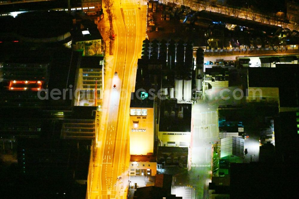 München at night from the bird perspective: Night lighting buildings and production halls on the premises of the Spaten-Brauerei brewery on Marsstrasse in the district of Maxvorstadt in Munich in the state Bavaria, Germany