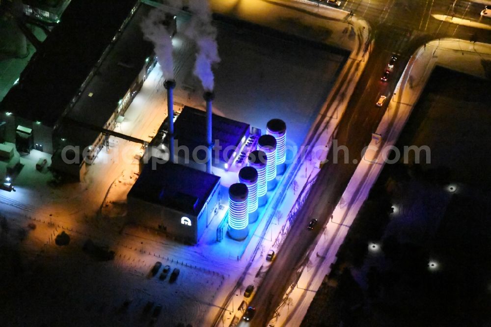 Aerial image at night Berlin - Night view wintry snowy power station plants of the combined heat and power station - regional heat of BTB Blockheizkraftwerks-Traeger- und Betreibergesellschaft mbH on the Wegedornstrasse im Stadtteil Adlershof in Berlin