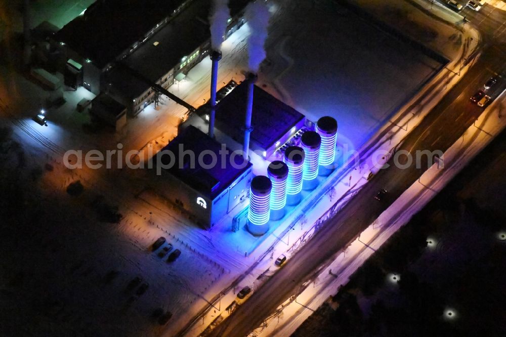 Berlin at night from above - Night view wintry snowy power station plants of the combined heat and power station - regional heat of BTB Blockheizkraftwerks-Traeger- und Betreibergesellschaft mbH on the Wegedornstrasse im Stadtteil Adlershof in Berlin