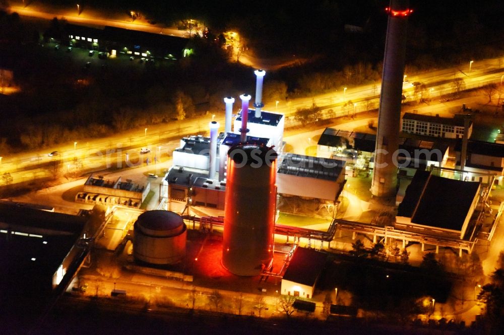 Schwerin at night from above - Night view power station plants of the combined heat and power station - regional heat company Stadtwerke Schwerin GmbH (SWS) in Schwerin in the state Mecklenburg - Western Pomerania