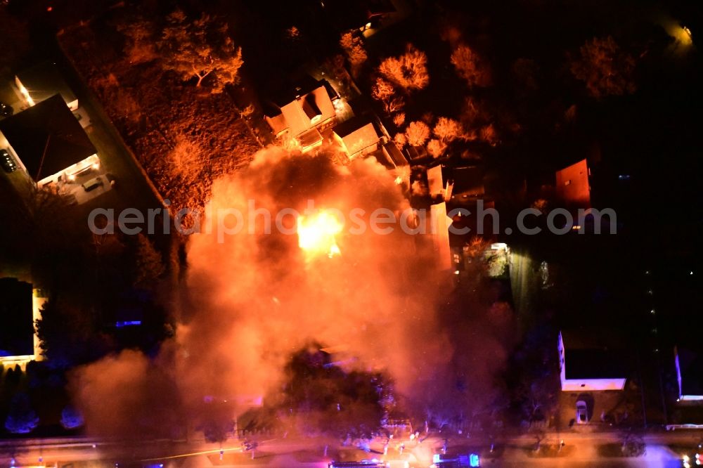 Aerial image at night Stahnsdorf - Night lighting fire- Ruins One family house in a residential area Sputendorfer Strasse - Enzianweg in Stahnsdorf in the state Brandenburg, Germany