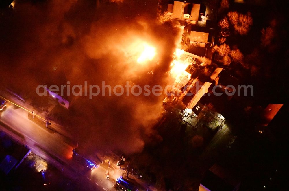 Stahnsdorf at night from above - Night lighting fire- Ruins One family house in a residential area Sputendorfer Strasse - Enzianweg in Stahnsdorf in the state Brandenburg, Germany