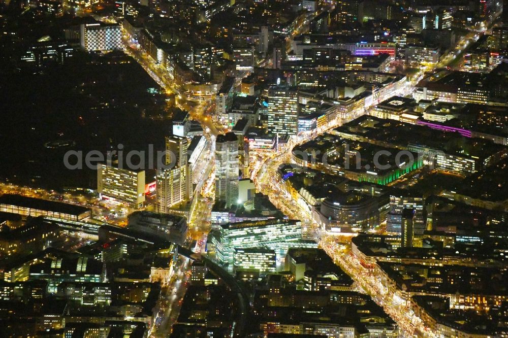 Berlin at night from the bird perspective: Night lighting of the Breitscheidplatzes with the traditional Christmas fair to Protestant imperial Wilhelm Gedaechtniskirche, between Kurfuerstendamm, the Joachimsthaler strasse and the Budapest strasse in the Berlin part of town Charlottenburg