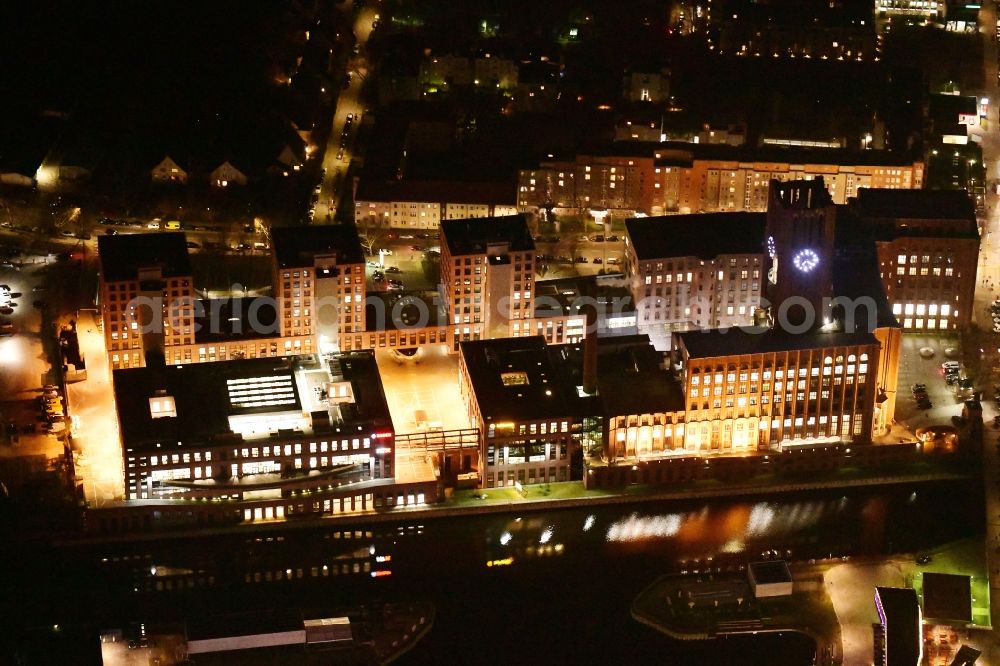 Aerial photograph at night Berlin - Night lighting office building - Ensemble on Ullsteinstrasse in the district Tempelhof in Berlin, Germany