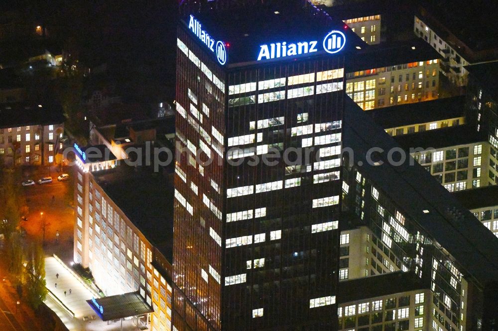 Berlin at night from the bird perspective: Night lighting Office and corporate management high-rise building An den Treptowers in the district Treptow in Berlin, Germany