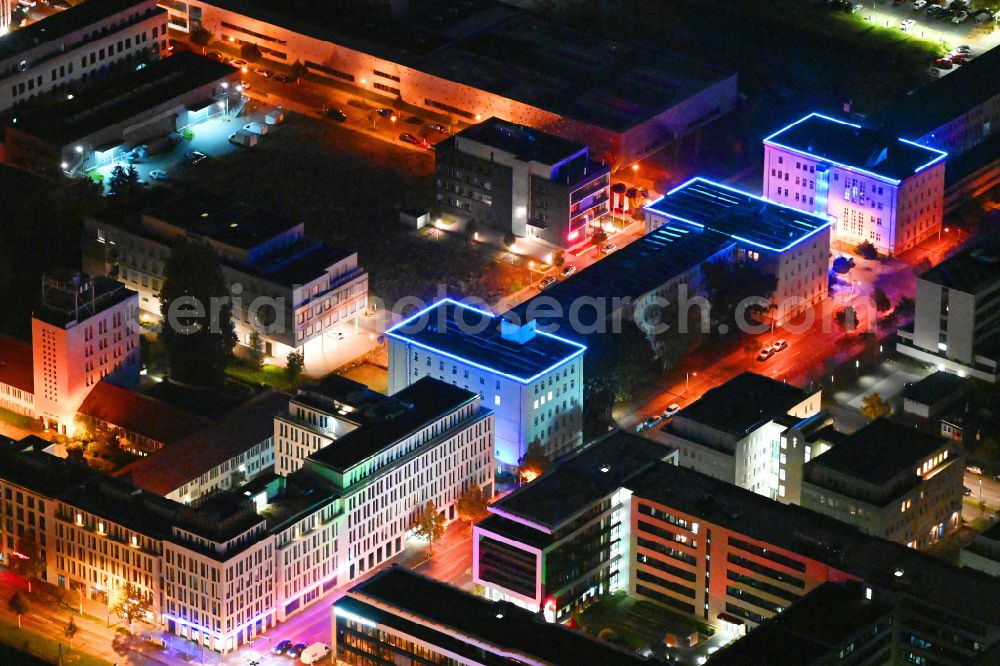 Berlin at night from the bird perspective: Night lighting office building of ARRI Lighting Solutions GmbH in the district Adlershof in Berlin, Germany