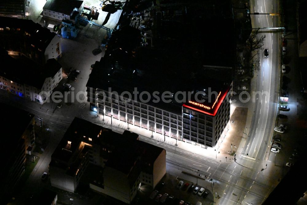 Aerial photograph at night Jena - Night lighting office building Intershop Communications AG on Steinweg in Jena in the state Thuringia, Germany