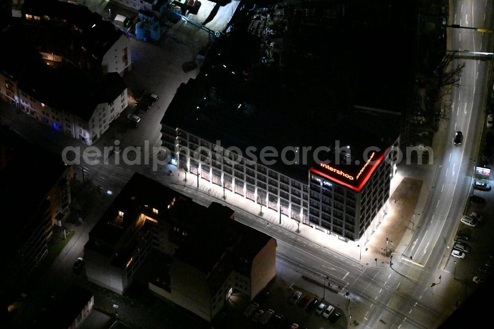 Aerial image at night Jena - Night lighting office building Intershop Communications AG on Steinweg in Jena in the state Thuringia, Germany