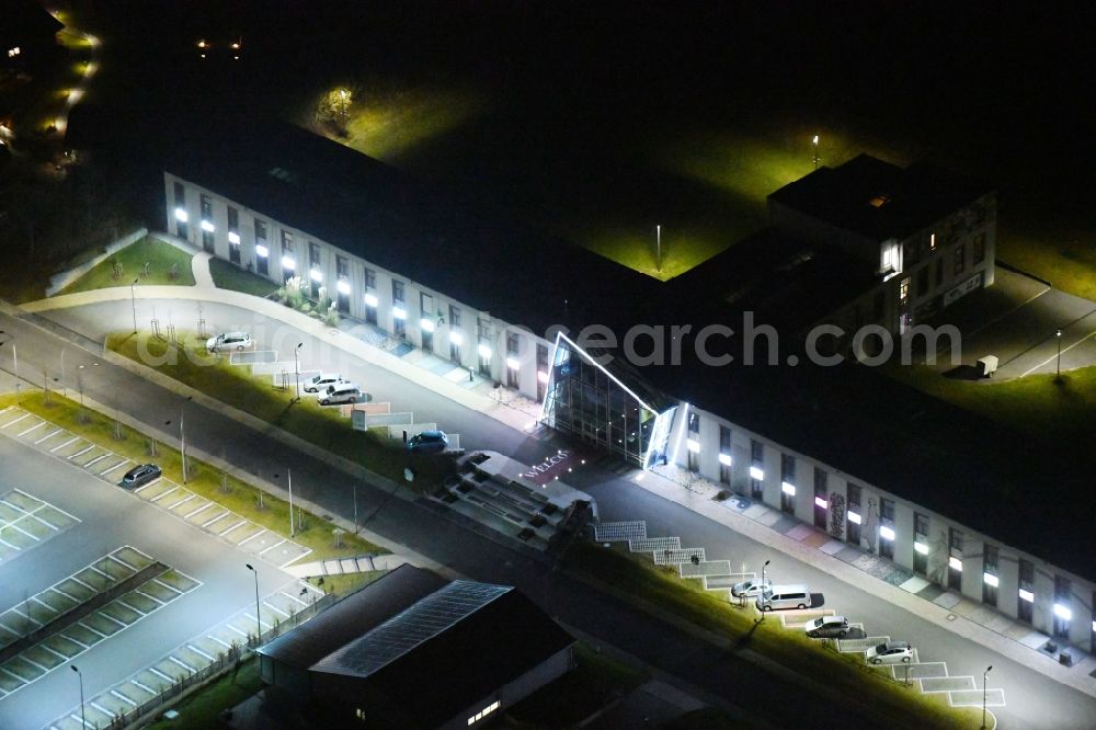 Aerial photograph at night Weimar - Night lighting Office building of Saller Bau GmbH In of Buttergrube in Weimar in the state Thuringia, Germany