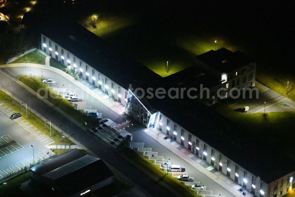 Aerial image at night Weimar - Night lighting Office building of Saller Bau GmbH In of Buttergrube in Weimar in the state Thuringia, Germany