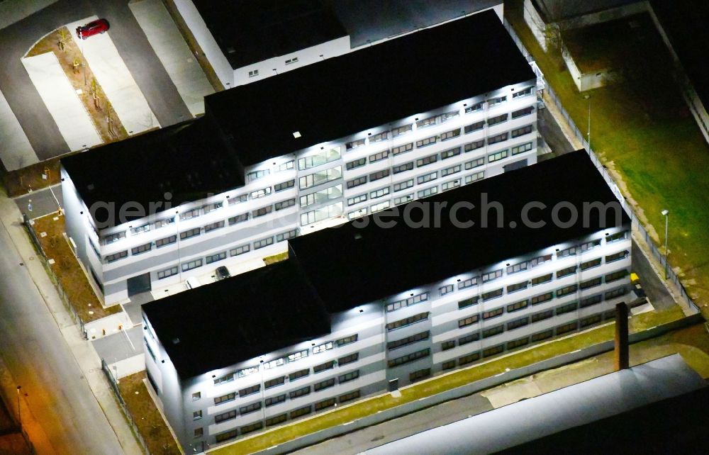 Aerial image at night Wolfsburg - Night lighting Office building of VOLKE Entwicklungsring AG in Wolfsburg in the state Lower Saxony, Germany