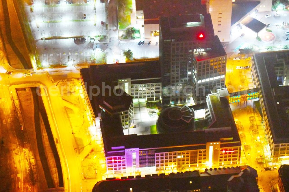 Leipzig at night from the bird perspective: Night lighting Office and bank building complex in Loehrs Carre in Leipzig in the state of Saxony. Sachsen LB and Sparkasse Leipzig have their headquarters in the highrise