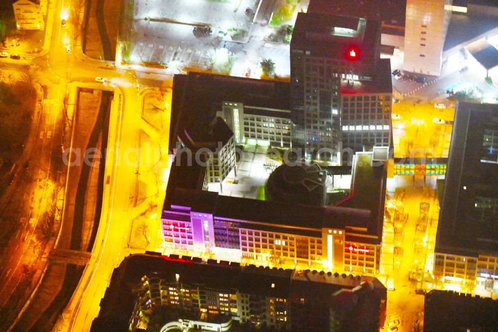 Aerial photograph at night Leipzig - Night lighting Office and bank building complex in Loehrs Carre in Leipzig in the state of Saxony. Sachsen LB and Sparkasse Leipzig have their headquarters in the highrise