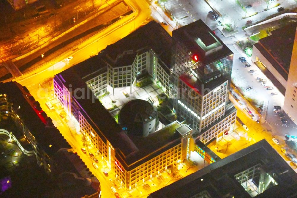 Aerial image at night Leipzig - Night lighting Office and bank building complex in Loehrs Carre in Leipzig in the state of Saxony. Sachsen LB and Sparkasse Leipzig have their headquarters in the highrise