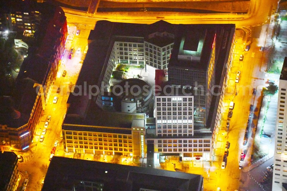 Leipzig at night from the bird perspective: Night lighting Office and bank building complex in Loehrs Carre in Leipzig in the state of Saxony. Sachsen LB and Sparkasse Leipzig have their headquarters in the highrise