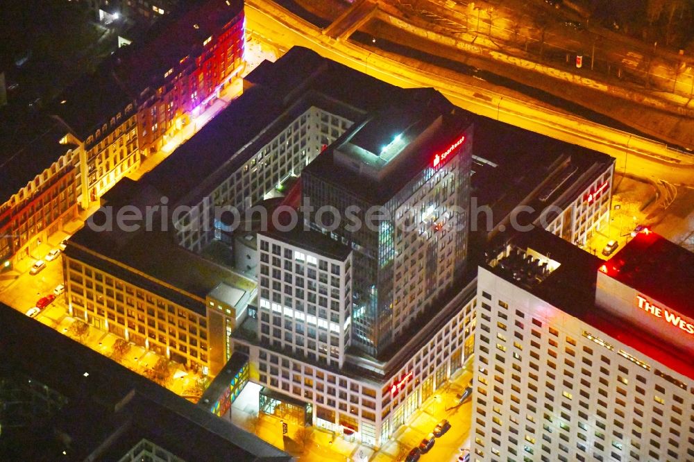 Aerial photograph at night Leipzig - Night lighting Office and bank building complex in Loehrs Carre in Leipzig in the state of Saxony. Sachsen LB and Sparkasse Leipzig have their headquarters in the highrise