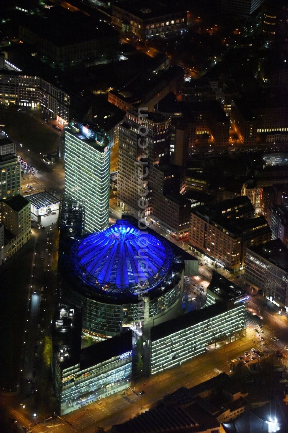 Aerial image at night Berlin - Night view office tower Bahn Tower at Sony Center on place Potsdamer Platz in Berlin in Germany