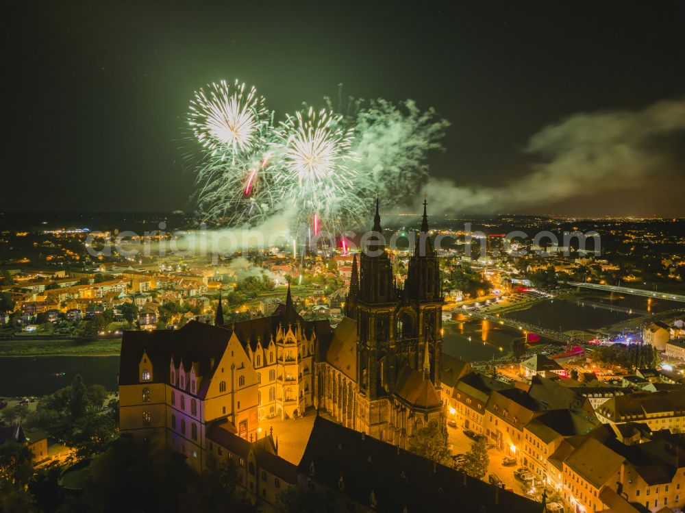 Meißen at night from above - Night lights and lighting fireworks over the castle complex at the Albrechtsburg with the Hochstift Cathedral on the Domplatz on the banks of the river Elbe in Meissen in the federal state of Saxony